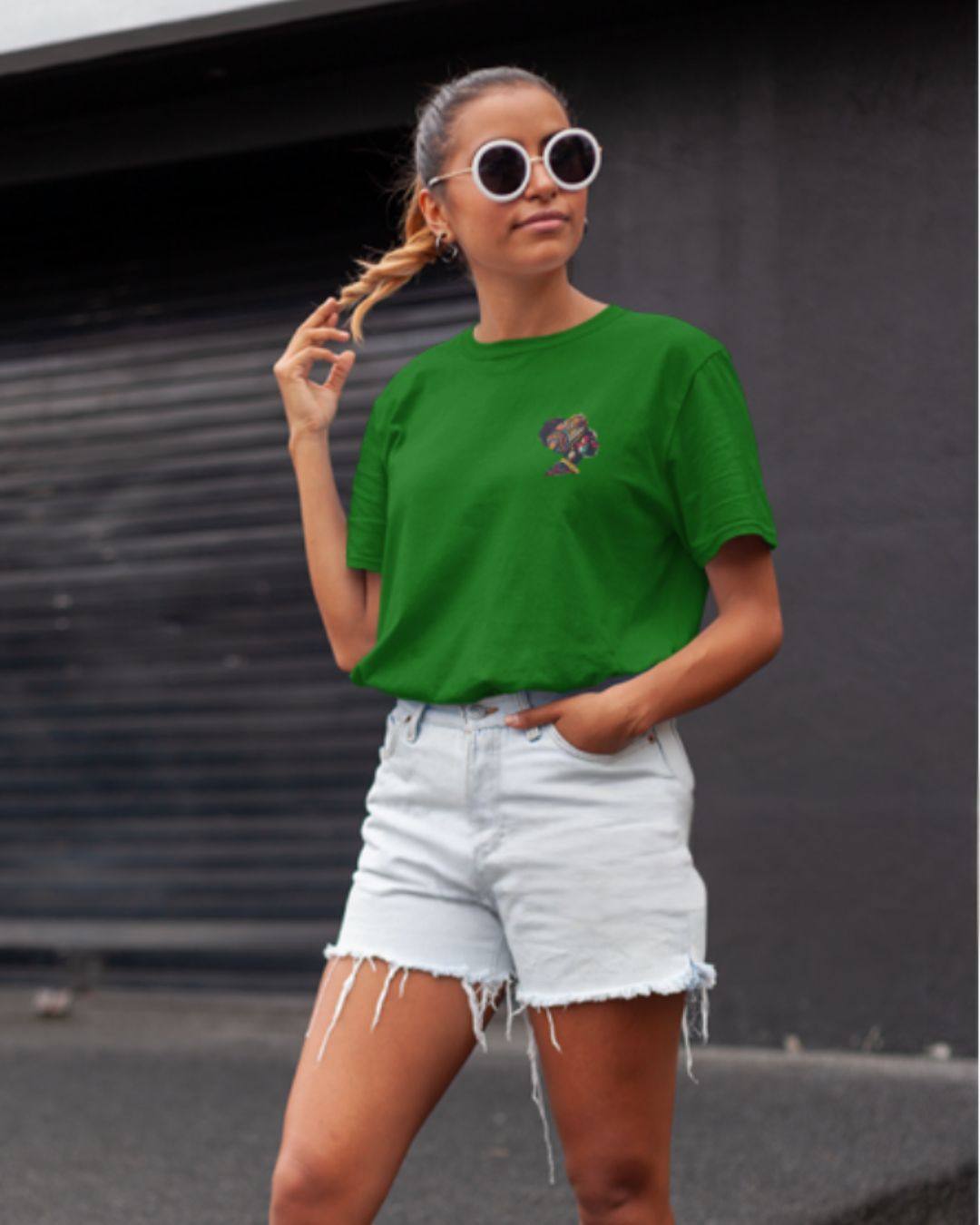 Green heather oversized t-shirt with a multi-colored artistic graphic on the back. Relaxed fit.